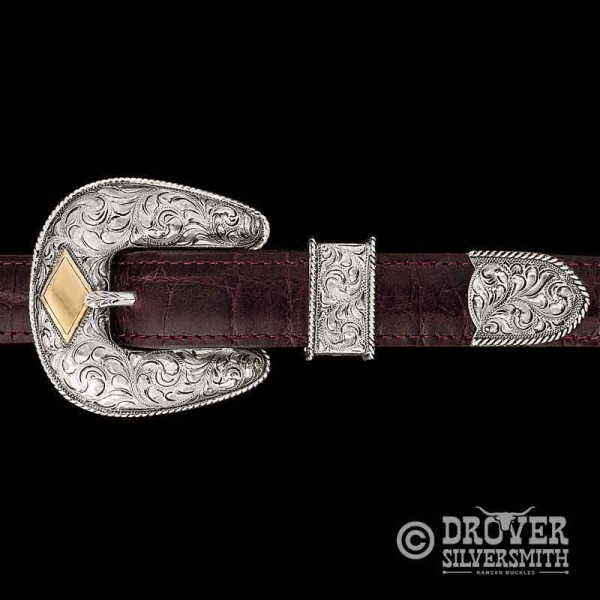 Unveil true elegance with The Murray Ranch Sterling Silver Belt Buckle, a hand engraved set and the standard of Western Elegance. Customize its bronze diamond with up to 4 letters. Add a second loop for a ranger buckle set now!